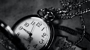 Black and white close-up photograph of a metal pocketwatch.